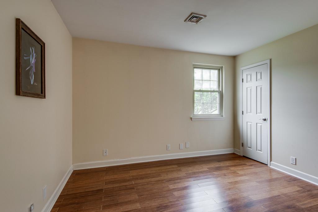 1056 General George Patton Road, Unit 1056 Nashville, TN 37221 - Photo 21 of 30 an empty room with wooden floor and windows