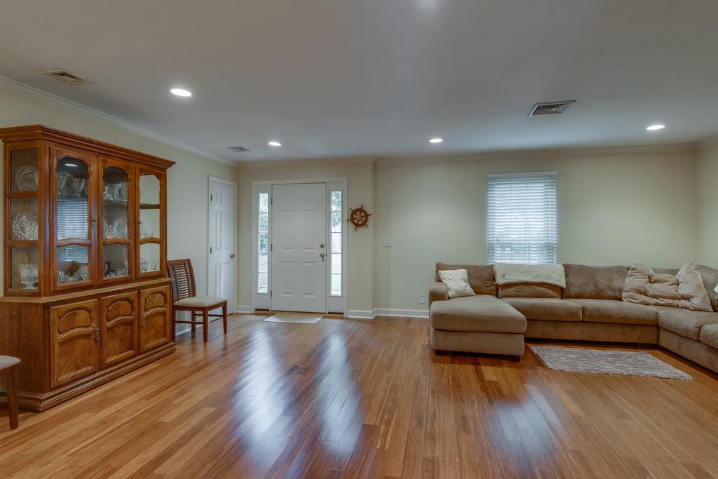 1056 General George Patton Road, Unit 1056 Nashville, TN 37221 - Photo 4 of 30 a living room with furniture and wooden floor