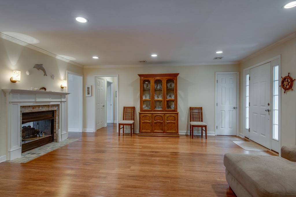 1056 General George Patton Road, Unit 1056 Nashville, TN 37221 - Photo 6 of 30 a view of a livingroom with furniture and a fireplace