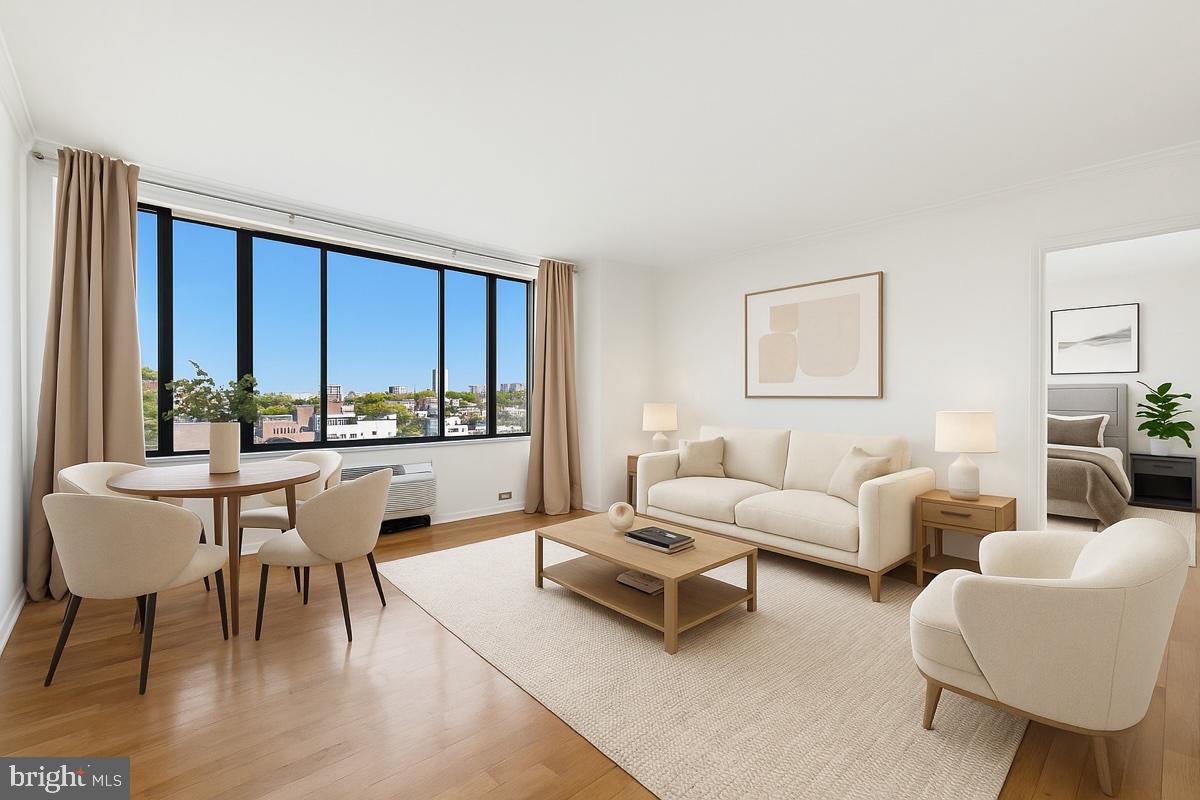 2001 Hamilton Street, Unit 1205 Philadelphia, PA 19130 - Photo 1 of 34 a living room with furniture a rug a lamp and a large window