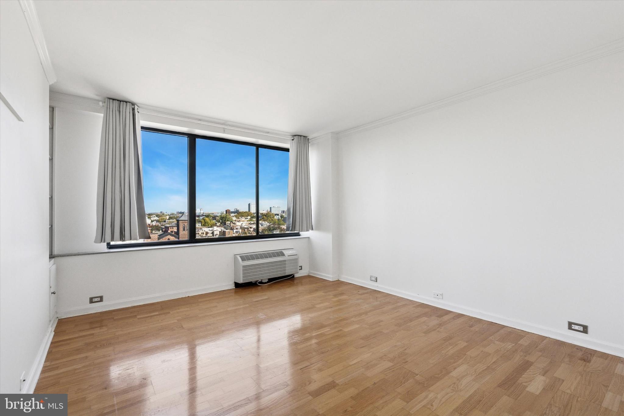 2001 Hamilton Street, Unit 1205 Philadelphia, PA 19130 - Photo 12 of 34 a view of an empty room with a window