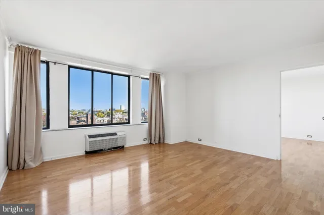 a view of an empty room with a window