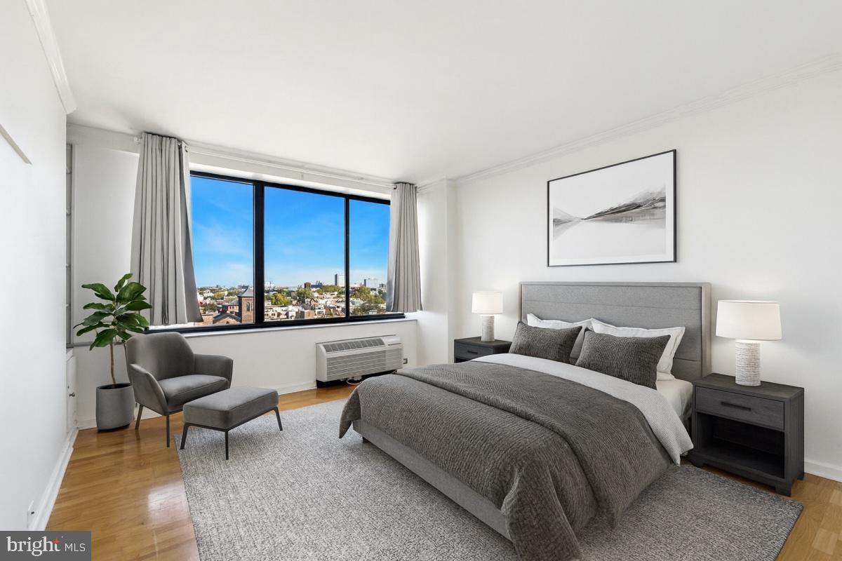 2001 Hamilton Street, Unit 1205 Philadelphia, PA 19130 - Photo 10 of 34 a bedroom with a bed and a large window