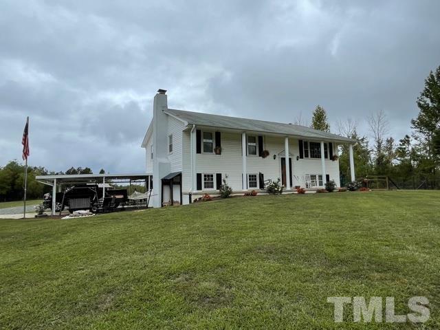 1641 Oak Grove Road Roxboro, NC 27574 - Photo 1 of 23 a view of a house with a big yard and sitting area
