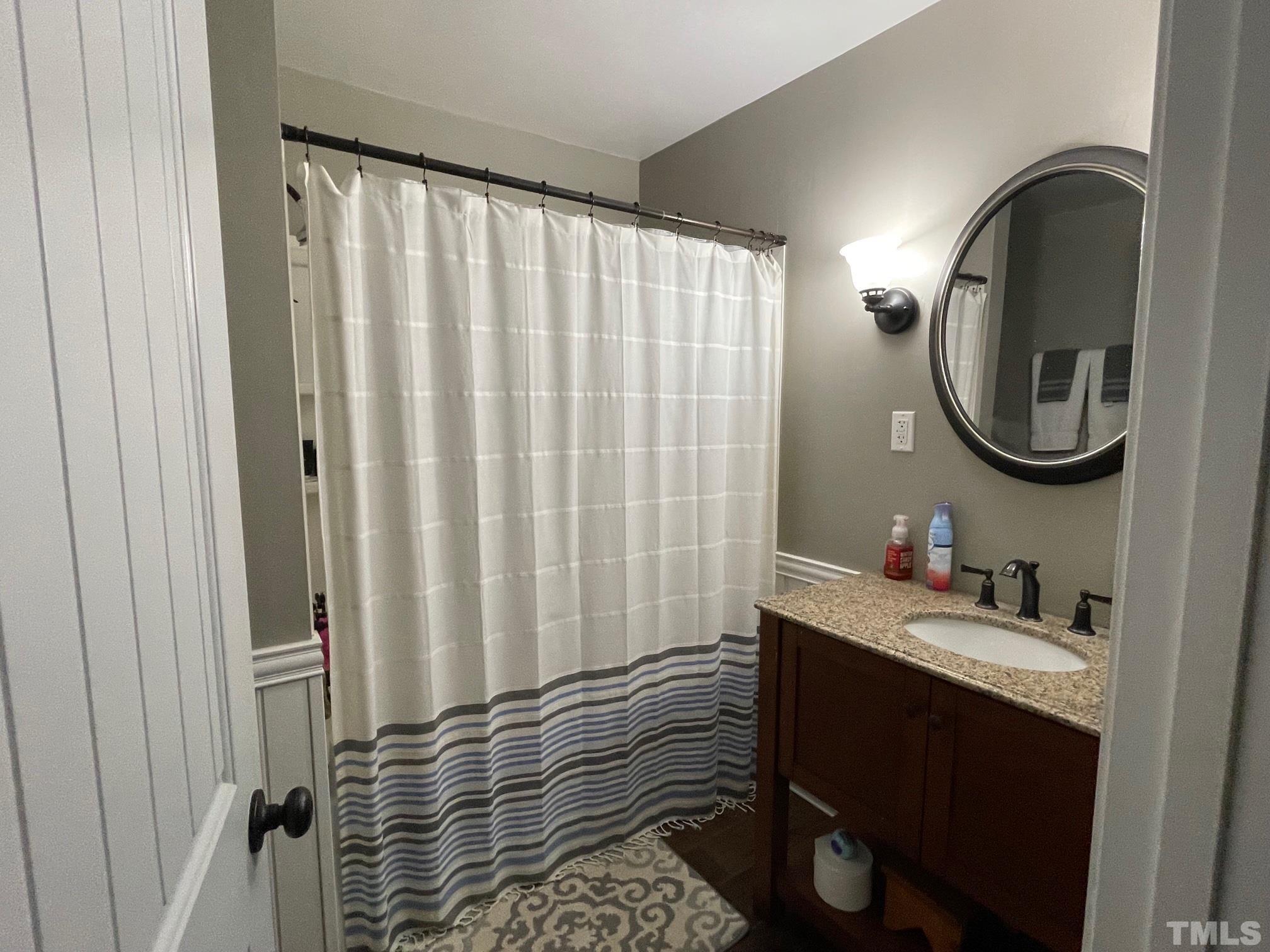 1641 Oak Grove Road Roxboro, NC 27574 - Photo 11 of 23 a bathroom with a sink and a mirror