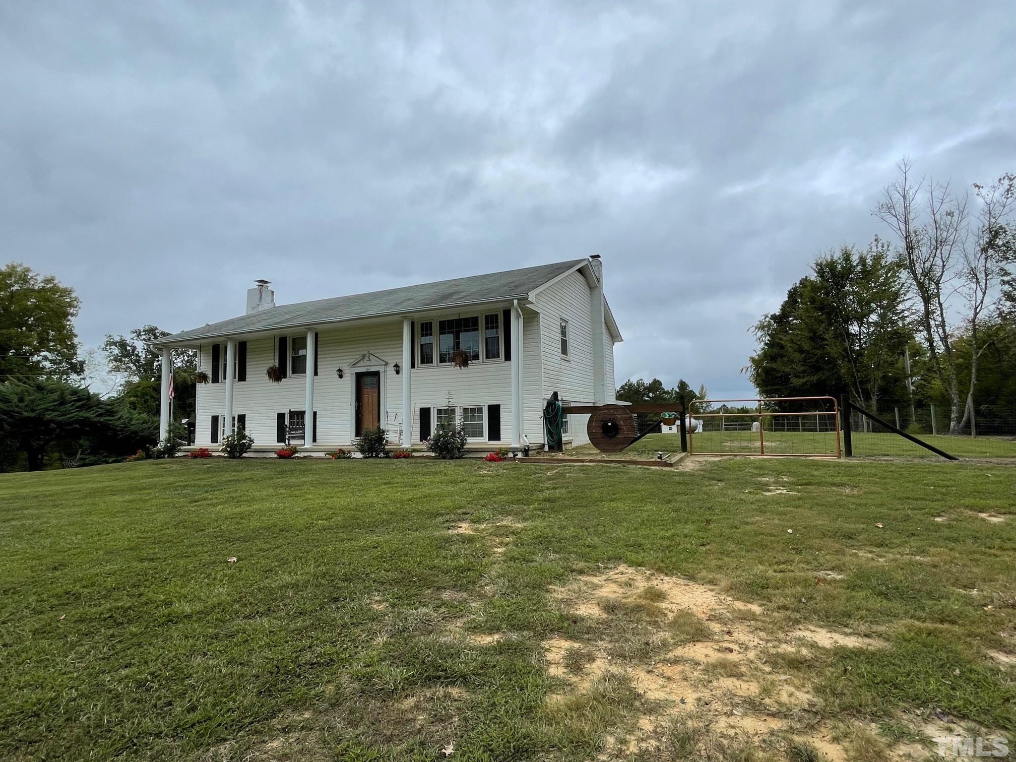 1641 Oak Grove Road Roxboro, NC 27574 - Photo 16 of 23 a front view of a house with a yard