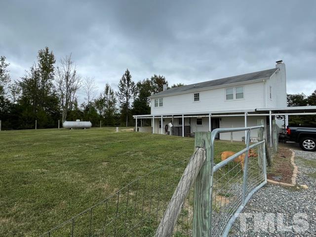 1641 Oak Grove Road Roxboro, NC 27574 - Photo 18 of 23 a view of a house with backyard