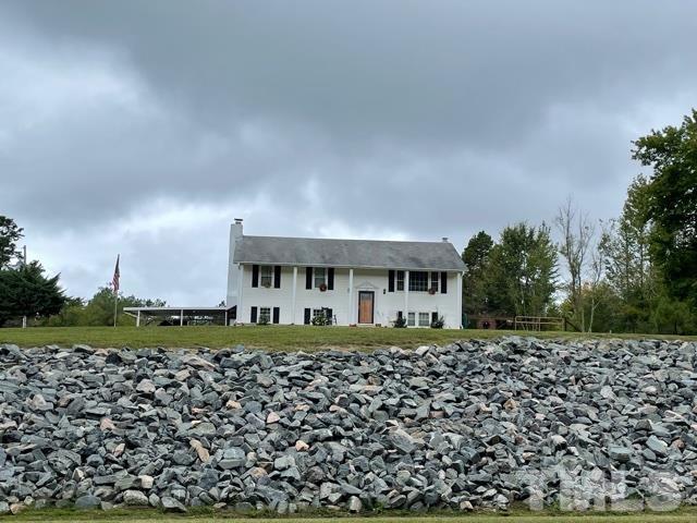 1641 Oak Grove Road Roxboro, NC 27574 - Photo 23 of 23 a front view of a house with a yard
