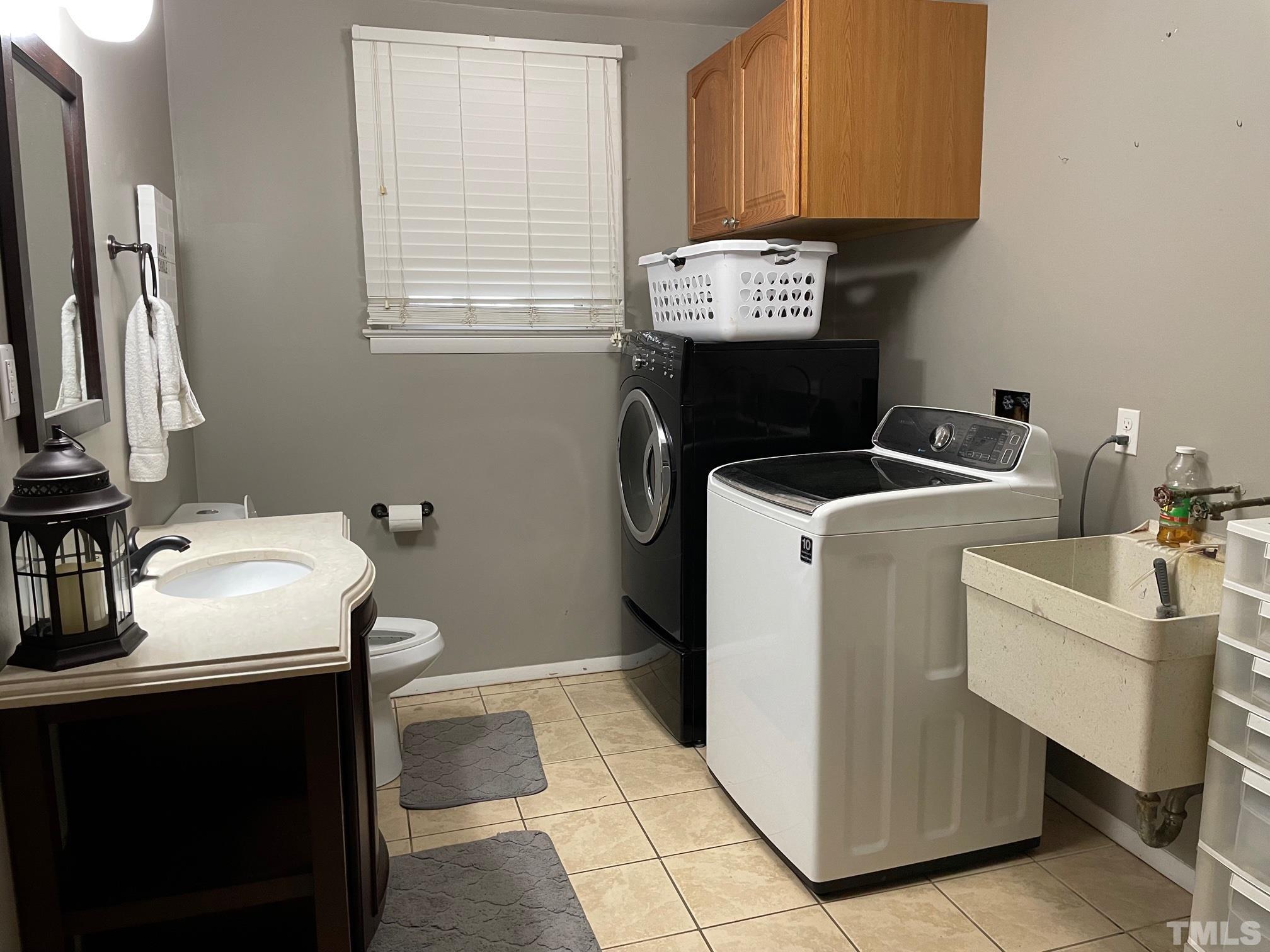 1641 Oak Grove Road Roxboro, NC 27574 - Photo 5 of 23 a utility room with dryer and washer