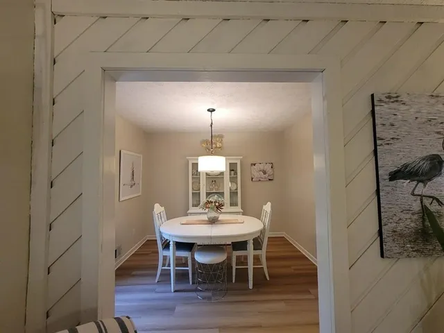 a dining room with furniture and window