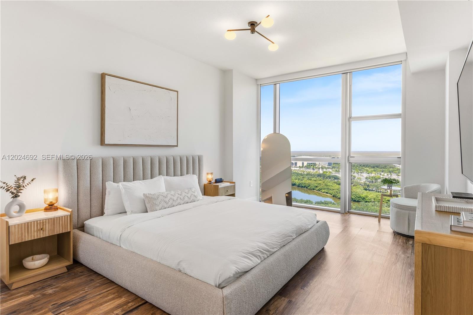 2641 North Flamingo Road, Unit 2605N Sunrise, FL 33323 - Photo 12 of 56 a bedroom with bed and large window