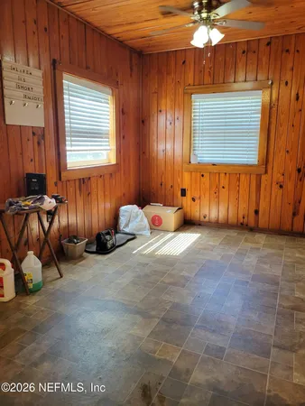 a view of a room with gym equipment and window