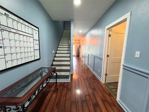 a view of entryway with wooden floor