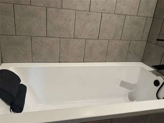a bathroom with a bathtub