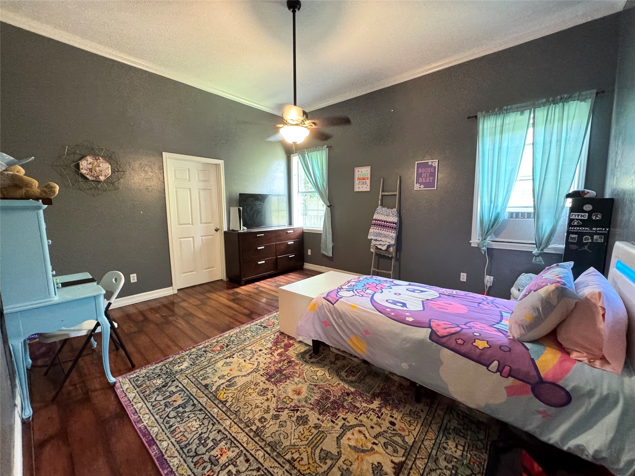 505 North 6th Street Silsbee, TX 77656 - Photo 20 of 35 a bedroom with a bed and wooden floor