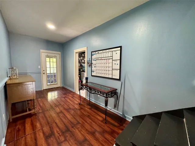 a room with lots of flowers and a rug