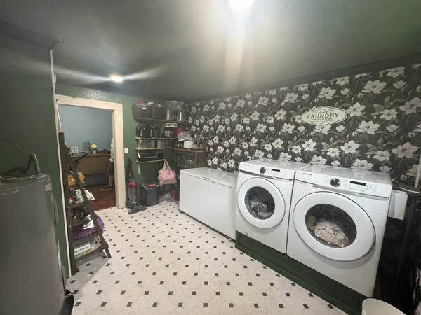 a view of a storage & utility room with washer and dryer