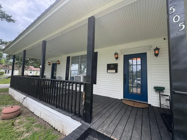 a view of a porch with wooden floor