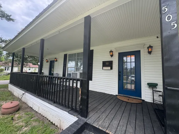a view of a deck with wooden floor and outer view