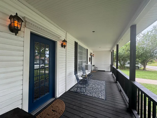 a view of a balcony with wooden floor