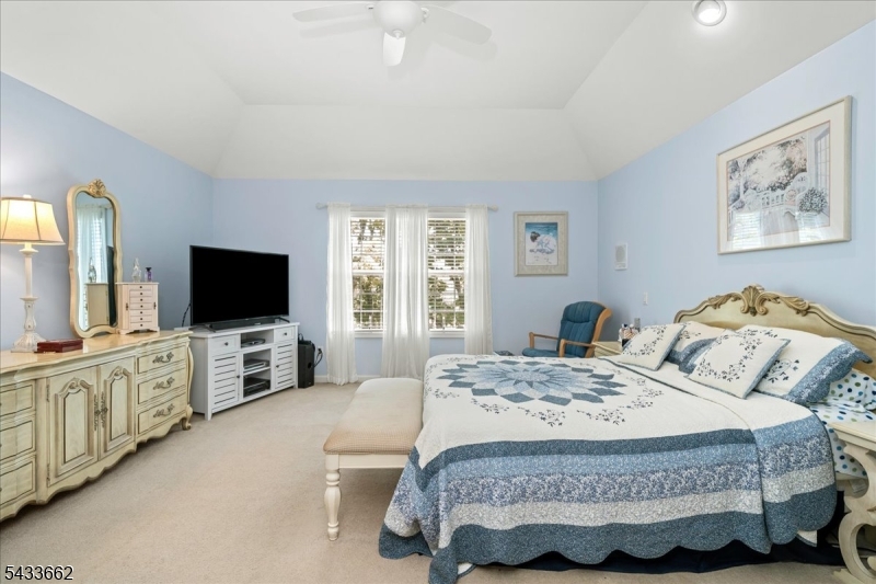 15 Bracken Hill Road Hamburg, NJ 07419 - Photo 21 of 44 a bedroom with a large bed and a flat screen tv
