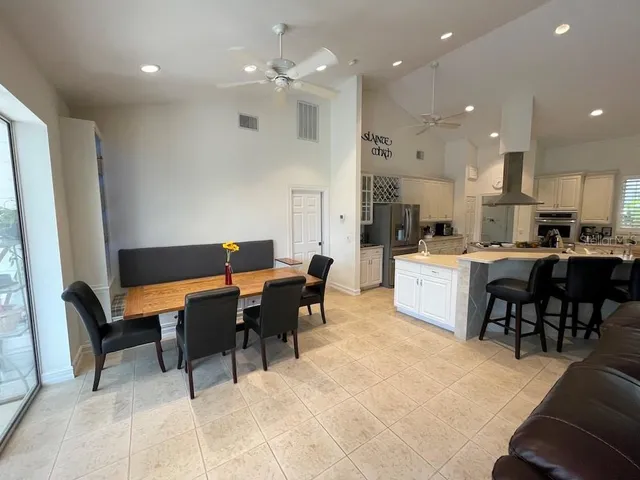 a living room with a furniture and a book shelf