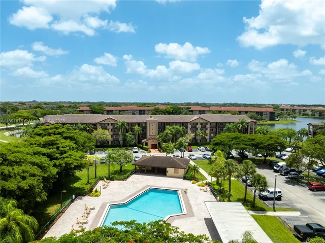 a view of a garden with lawn chairs
