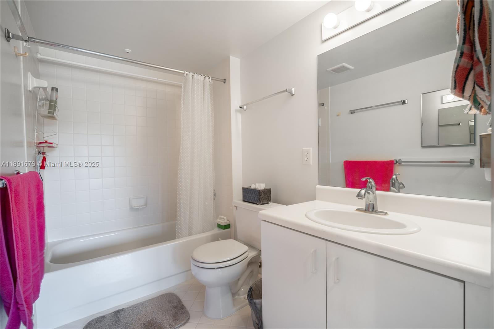 13700 Southwest 11th Street, Unit 309A Pembroke Pines, FL 33027 - Photo 25 of 31 a bathroom with a sink toilet and shower