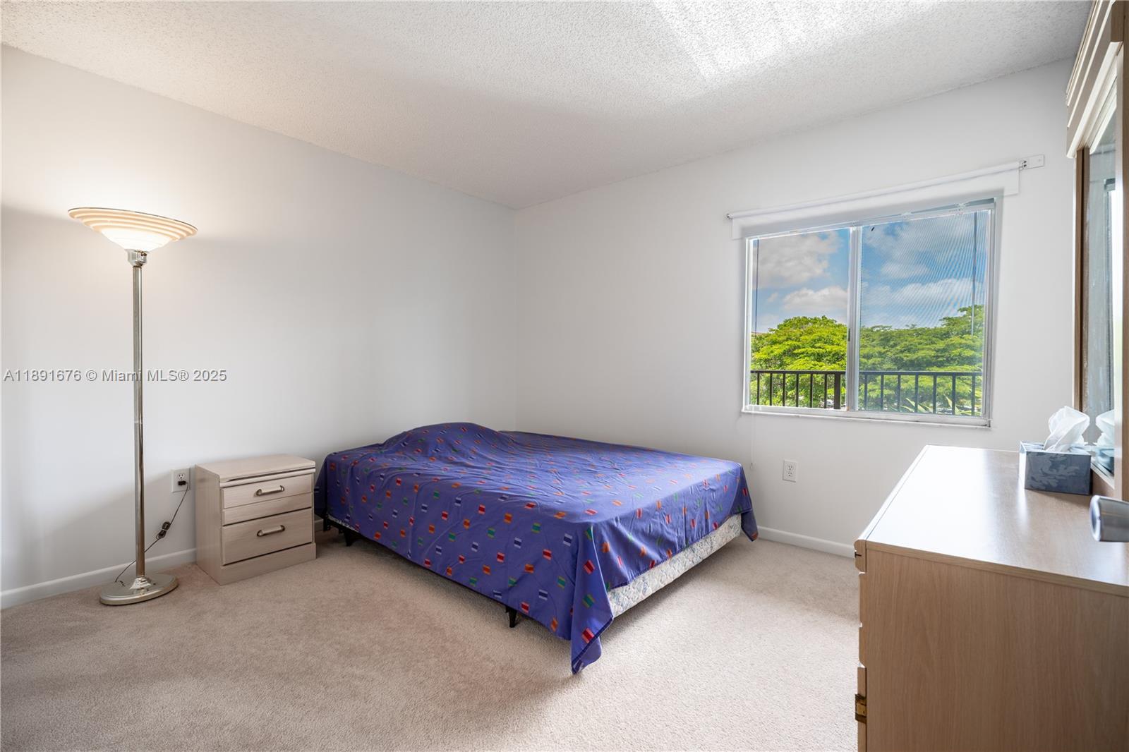 13700 Southwest 11th Street, Unit 309A Pembroke Pines, FL 33027 - Photo 26 of 31 a spacious bedroom with a bed and a window