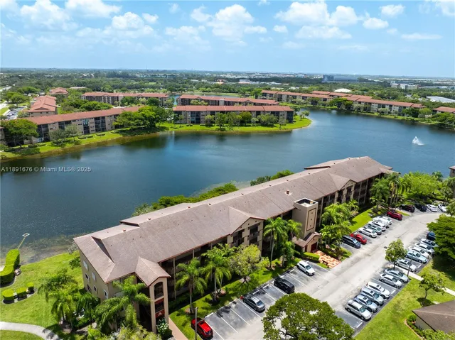 an aerial view of a house with a lake view