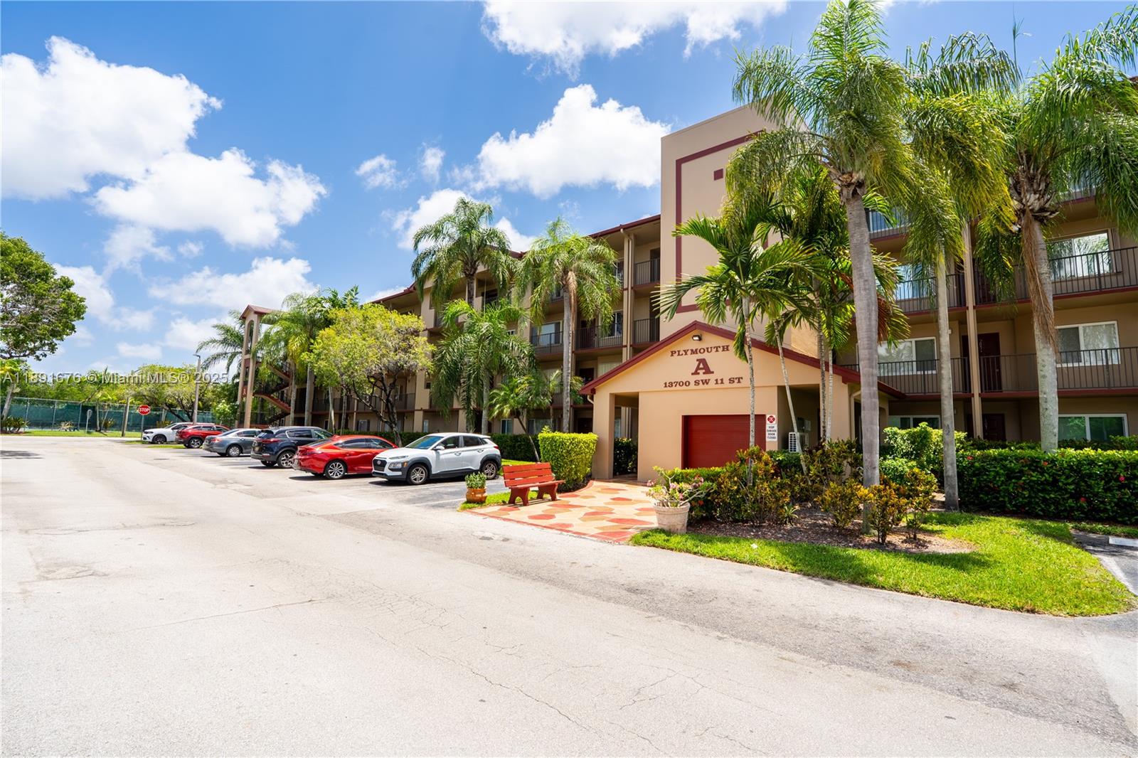 13700 Southwest 11th Street, Unit 309A Pembroke Pines, FL 33027 - Photo 31 of 31 a view of a parked cars in front of a house