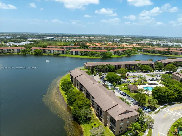 an aerial view of a house with a lake view