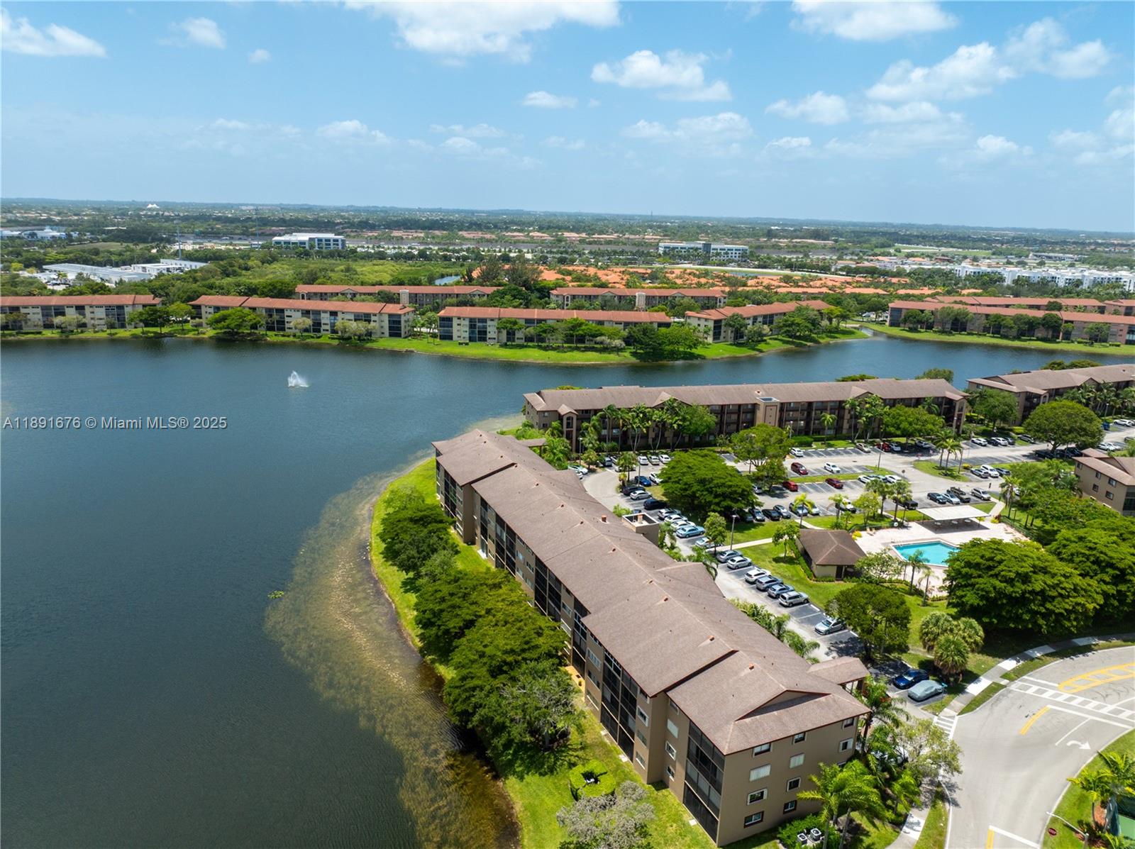 13700 Southwest 11th Street, Unit 309A Pembroke Pines, FL 33027 - Photo 5 of 31 an aerial view of a house with a lake view