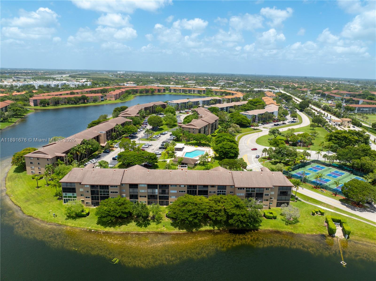 13700 Southwest 11th Street, Unit 309A Pembroke Pines, FL 33027 - Photo 6 of 31 an aerial view of residential houses with outdoor space and river