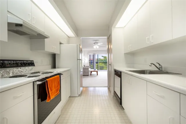 a kitchen with stainless steel appliances granite countertop a stove and a sink