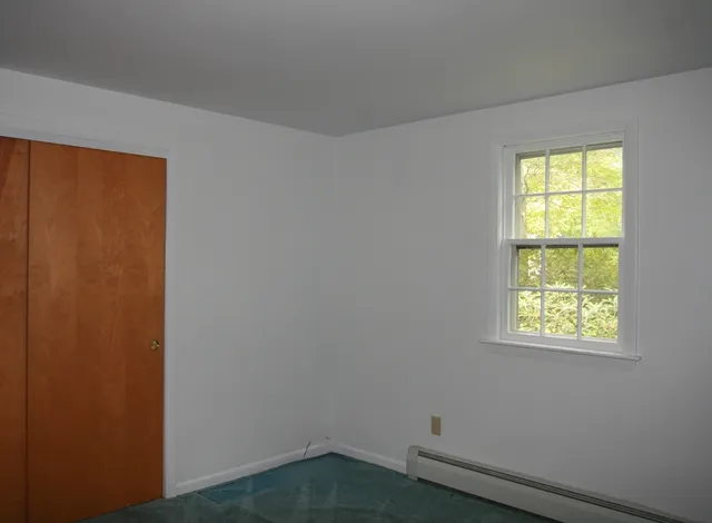 a door with a hallway to the house