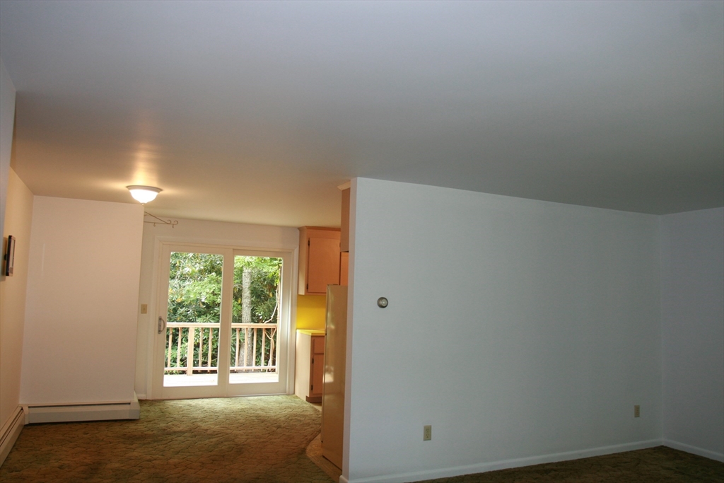 19 Oriole Lane Barnstable, MA 02648 - Photo 3 of 40 wooden floor and window in an empty room