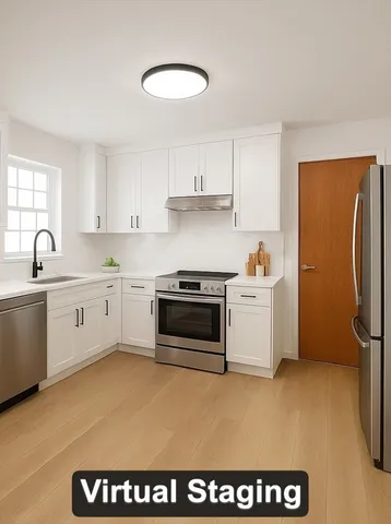 a large kitchen with a sink and stainless steel appliances