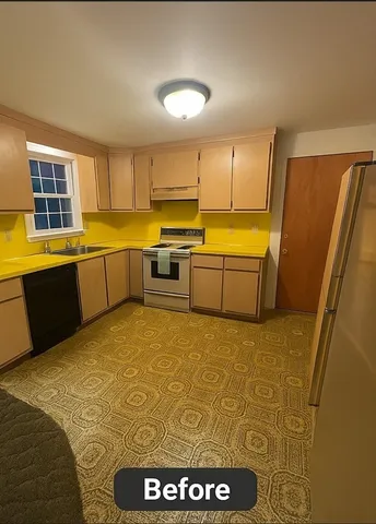 a kitchen with a sink stove and cabinets