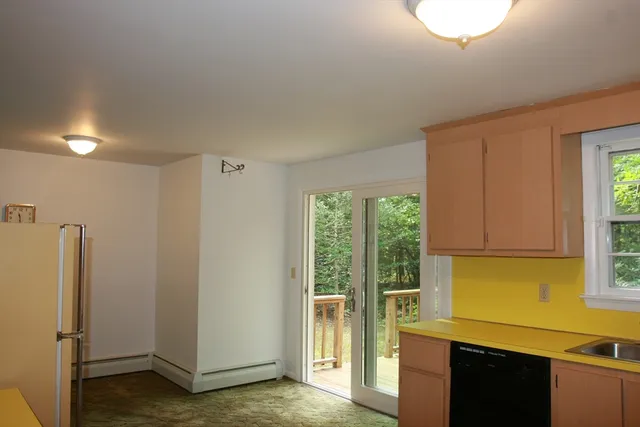 a view of balcony with wooden floor and outdoor seating