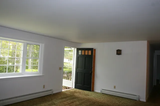 a view of an empty room and window