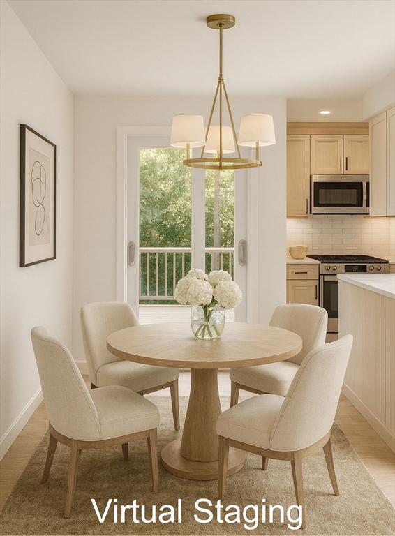 19 Oriole Lane Barnstable, MA 02648 - Photo 10 of 40 a view of a dining room with furniture window and outside view