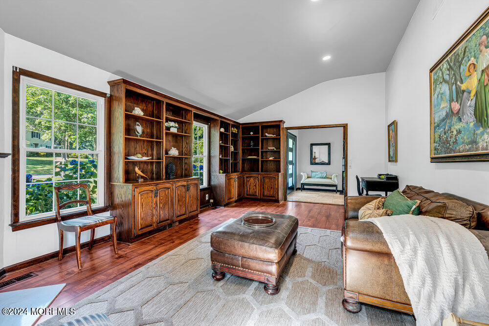 9 Comanche Drive Middletown, NJ 07716 - Photo 12 of 69 a living room with furniture and a large window