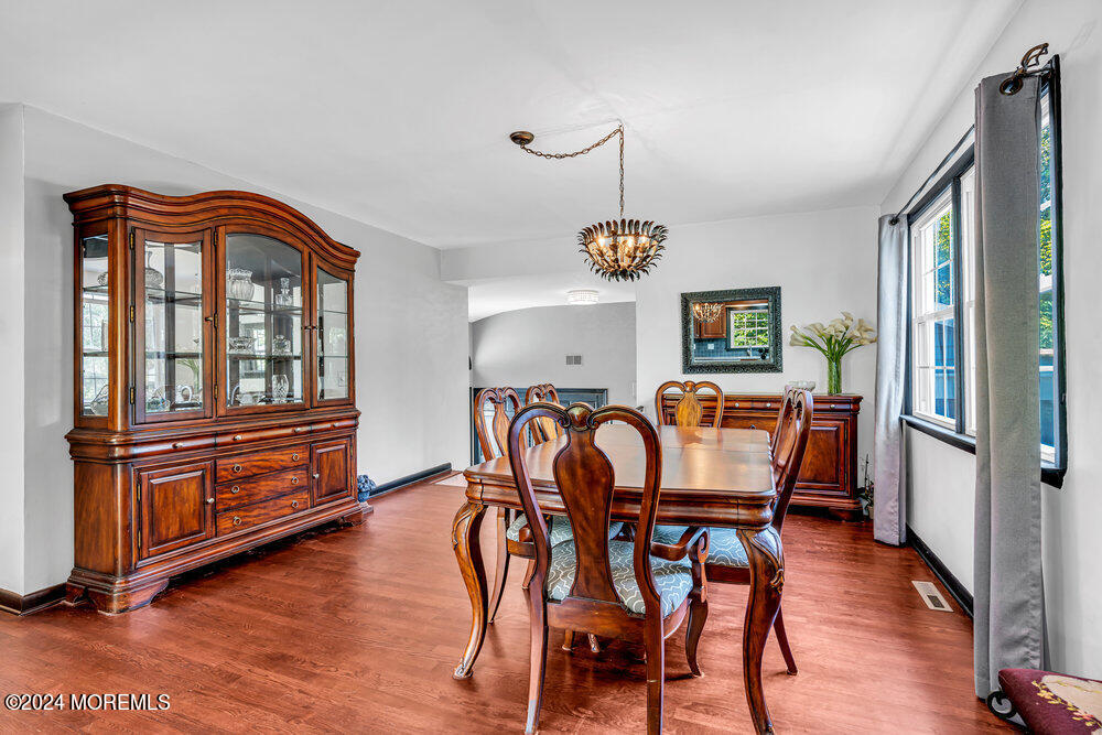 9 Comanche Drive Middletown, NJ 07716 - Photo 15 of 69 a dining room with furniture a window and wooden floor