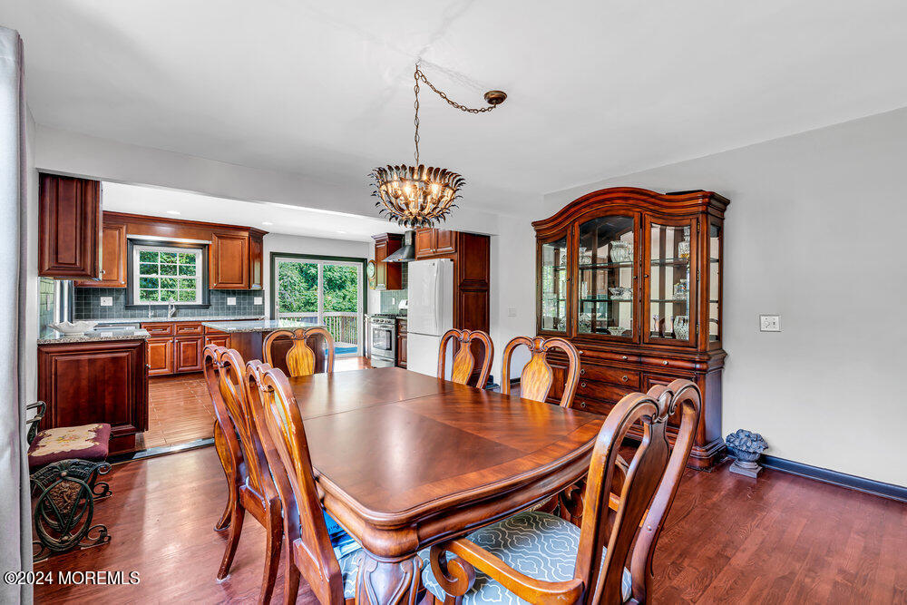 9 Comanche Drive Middletown, NJ 07716 - Photo 17 of 69 a view of a dining room with furniture window and wooden floor