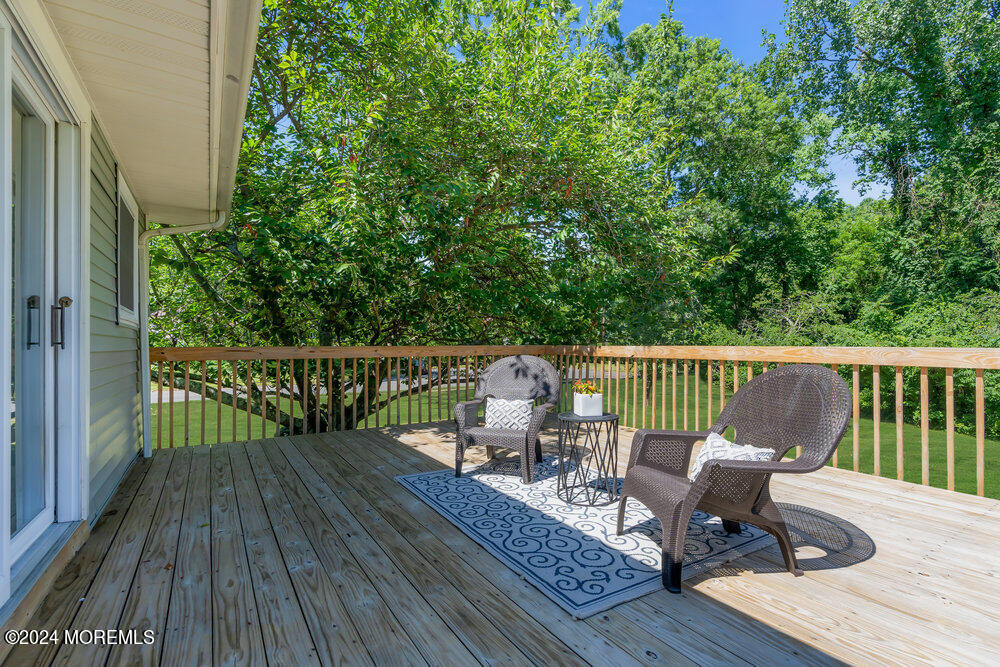 9 Comanche Drive Middletown, NJ 07716 - Photo 27 of 69 a view of a wooden deck with furniture