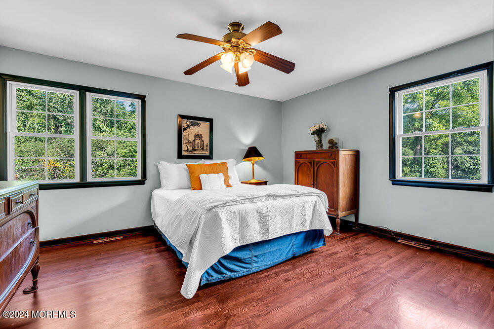 9 Comanche Drive Middletown, NJ 07716 - Photo 33 of 69 a bedroom with a large bed and a large window