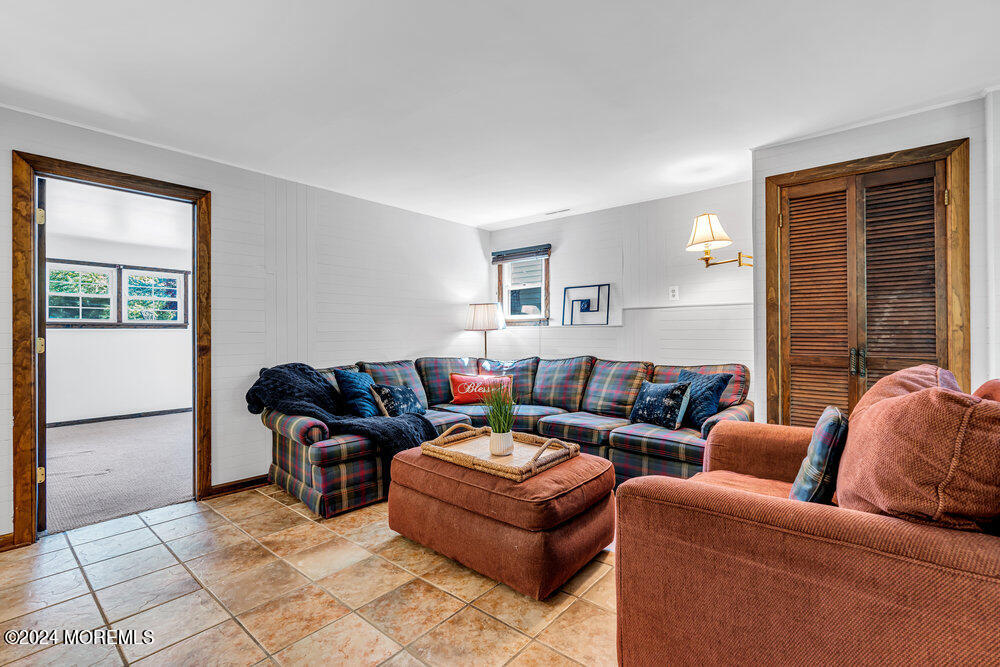 9 Comanche Drive Middletown, NJ 07716 - Photo 39 of 69 a living room with furniture and a window