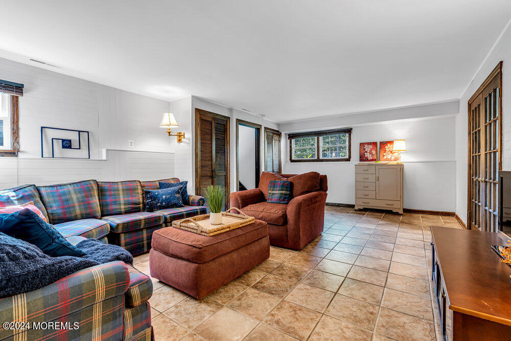 9 Comanche Drive Middletown, NJ 07716 - Photo 41 of 69 a living room with furniture and a window