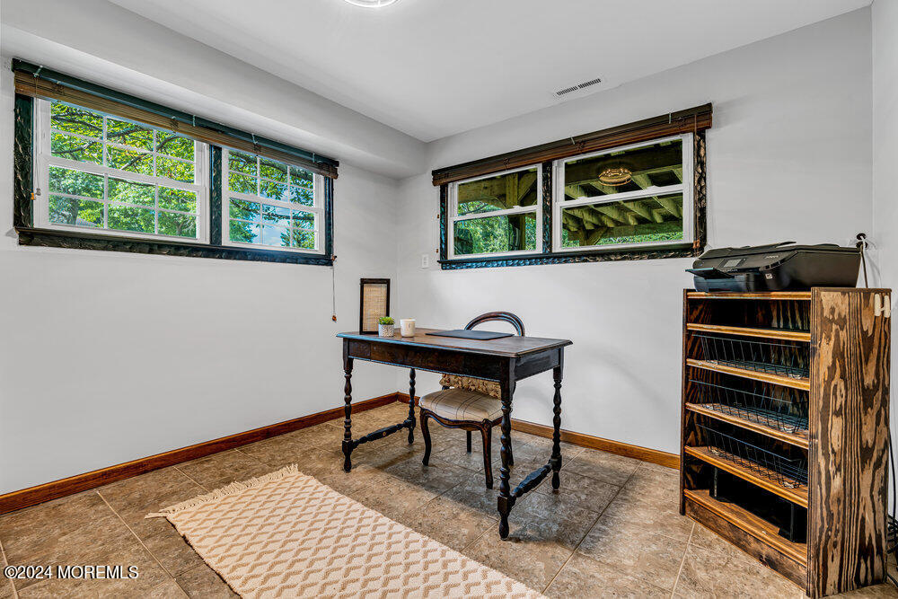 9 Comanche Drive Middletown, NJ 07716 - Photo 45 of 69 a view of a workspace with furniture and window